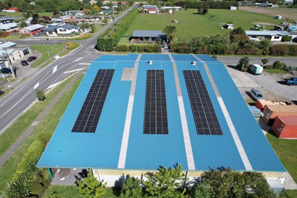 default Aerial view of commercial rooftop solar panel installation