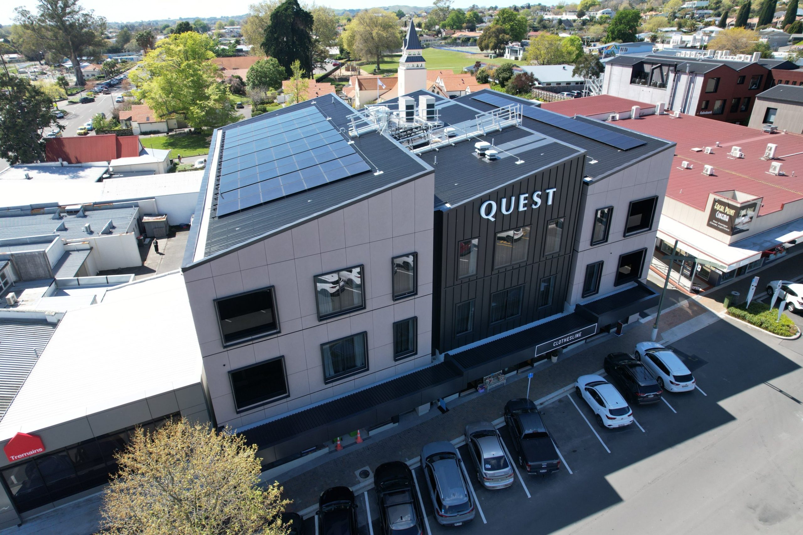 Aerial view of a Wallace Development Company commercial building with rooftop solar panels